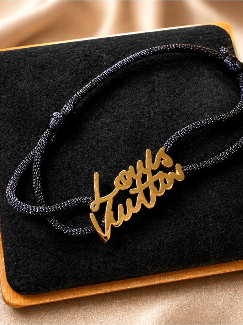 Lv Gold Script Logo Cord Bracelet on Black Cord